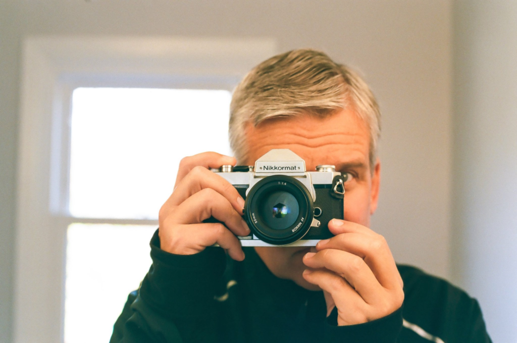 Mark Woodford shooting an old Nikon film camera